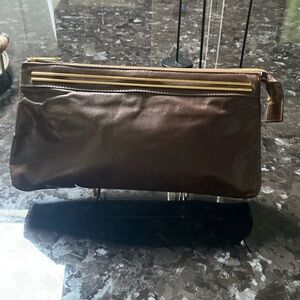 Dark brown leather clutch slightly worn pristine condition.